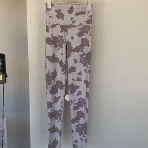 BeachRiot Cow print full length legging with light compression. White and mauve